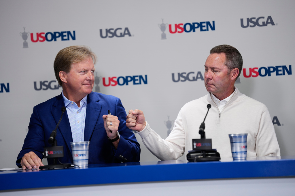 United States Golf Association's President Kevin Hammeron, CEO Mike Whan arrive for a news conference during the U.S. Open golf tournament at Shinnecock Hills Golf Club in Southampton, N.Y., Wednesday, June 17, 2026.(AP Photo/David J. Phillip)