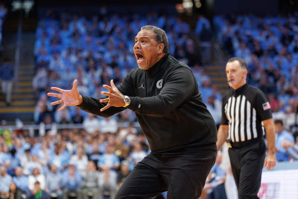 Georgetown head coach Ed Cooley shouts toward the court as a timeout starts during an NCAA college basketball game against North Carolina in Chapel Hill, N.C., Sunday, Dec. 7, 2025. (AP Photo/Ben McKeown)