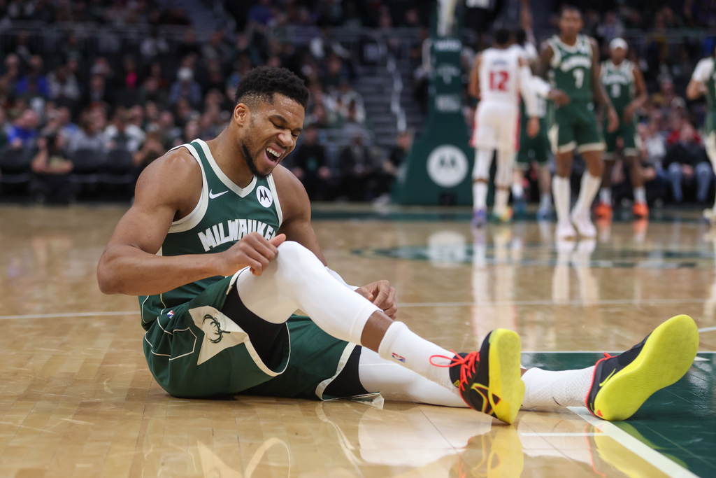 Milwaukee Bucks' Giannis Antetokounmpo reacts after suffering an injury during the first half an NBA basketball game against the Detroit Pistons, Wednesday, Dec. 3, 2025, in Milwaukee. (AP Photo/Kylie Bridenhagen)
