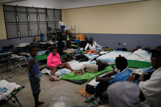 People take shelter in a school ahead of Hurricane Melissa's forecast arrival in Old Harbour, Jamaica, Monday, Oct. 27, 2025. (AP Photo/Matias Delacroix) People take shelter in a school ahead of Hurricane Melissa's forecast arrival in Old Harbour, Jamaica, Monday, Oct. 27, 2025. (AP Photo/Matias Delacroix)