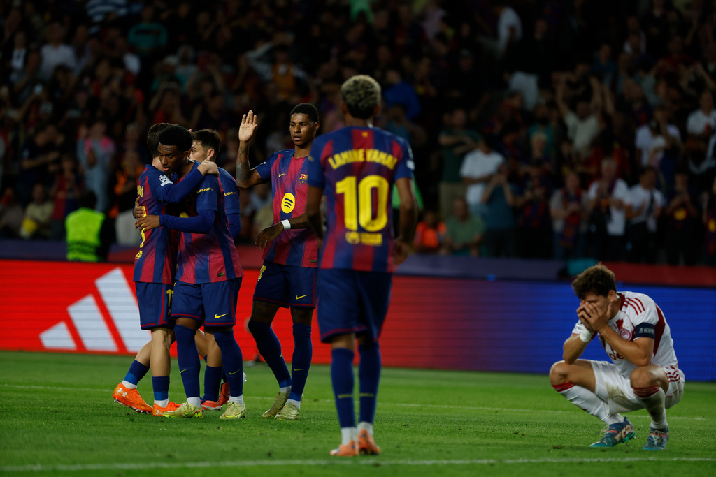 Barcelona's players celebrate the sixth goal of their team during the Champions League opening phase soccer match between Barcelona and Olympiacos in Barcelona, Spain, Tuesday, Oct. 21, 2025. (AP Photo/Joan Monfort)