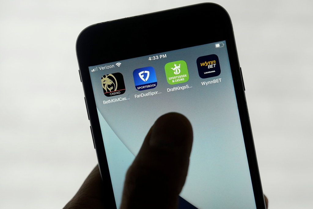 FILE - FanDuel, DraftKings and other online gambling apps are displayed on a phone in San Francisco, Sept. 26, 2022. (AP Photo/Jeff Chiu, File)