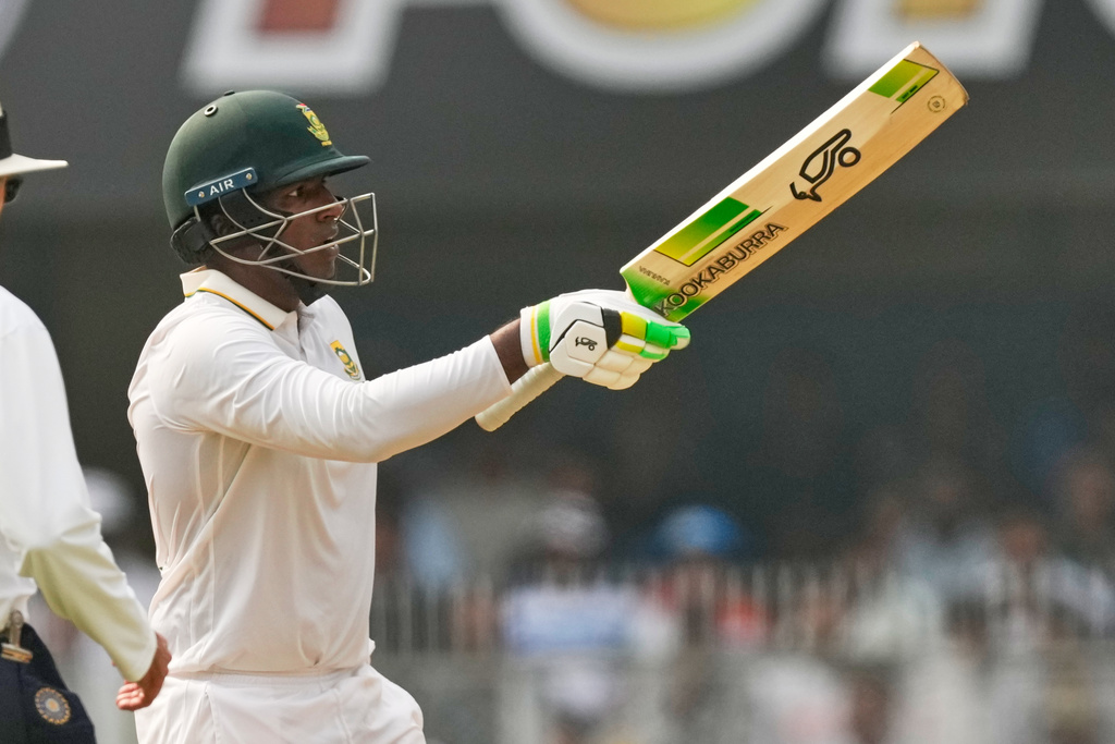 South Africa's Senuran Muthusamy celebrates after scoring fifty runs on the second day of the second cricket test match between India and South Africa in Guwahati, India, Saturday, Nov. 22, 2025. (AP Photo/Anupam Nath)