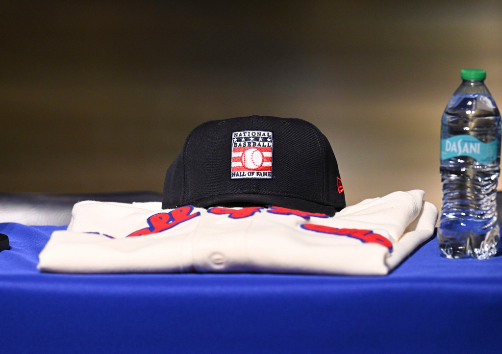 FILE - A ball cap and jersey are seen before newly elected Baseball Hall of Fame inductee's Ichiro Suzuki, Billy Wagner and CC Sabathia arrive for a news conference Thursday, Jan. 23, 2025, in Cooperstown, N.Y. (AP Photo/Hans Pennink,File)