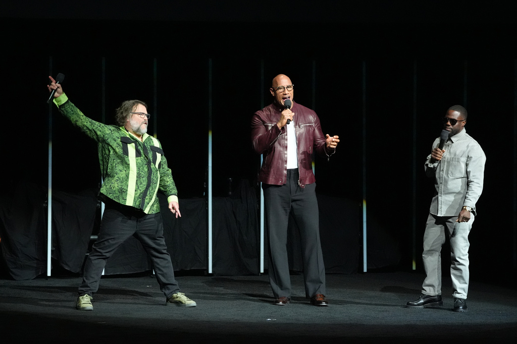 Jack Black, from left, Dwayne Johnson, and Kevin Hart, cast members in the upcoming film "Jumanji 3," appear during opening night and the Sony Pictures Entertainment presentation at CinemaCon on Monday, April 13, 2026, at Caesars Palace in Las Vegas. (AP Photo/Chris Pizzello)