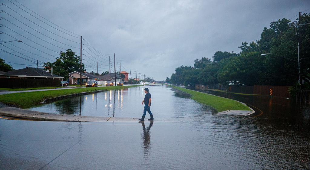 The West Esplanade Ave. canal in Kenner slowly recedes after over topping during Tropical Storm Arthur in New Orleans, Thursday, June 18, 2026. (David Grunfeld/The Times-Picayune/The New Orleans Advocate via AP)