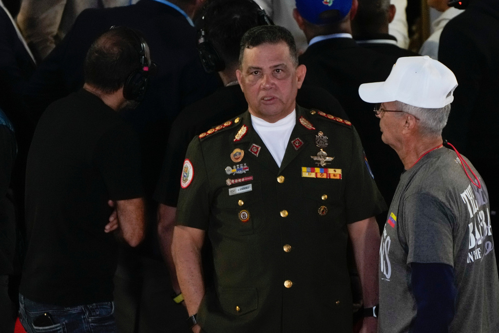 Venezuela's Defense Minister Gustavo Gonzalez Lopez waits for the World Baseball Classic trophy a day after his team's victory over the United States in the championship match, at the Miraflores presidential palace in Caracas, Venezuela, Wednesday, March 18, 2026. (AP Photo/Ariana Cubillos)