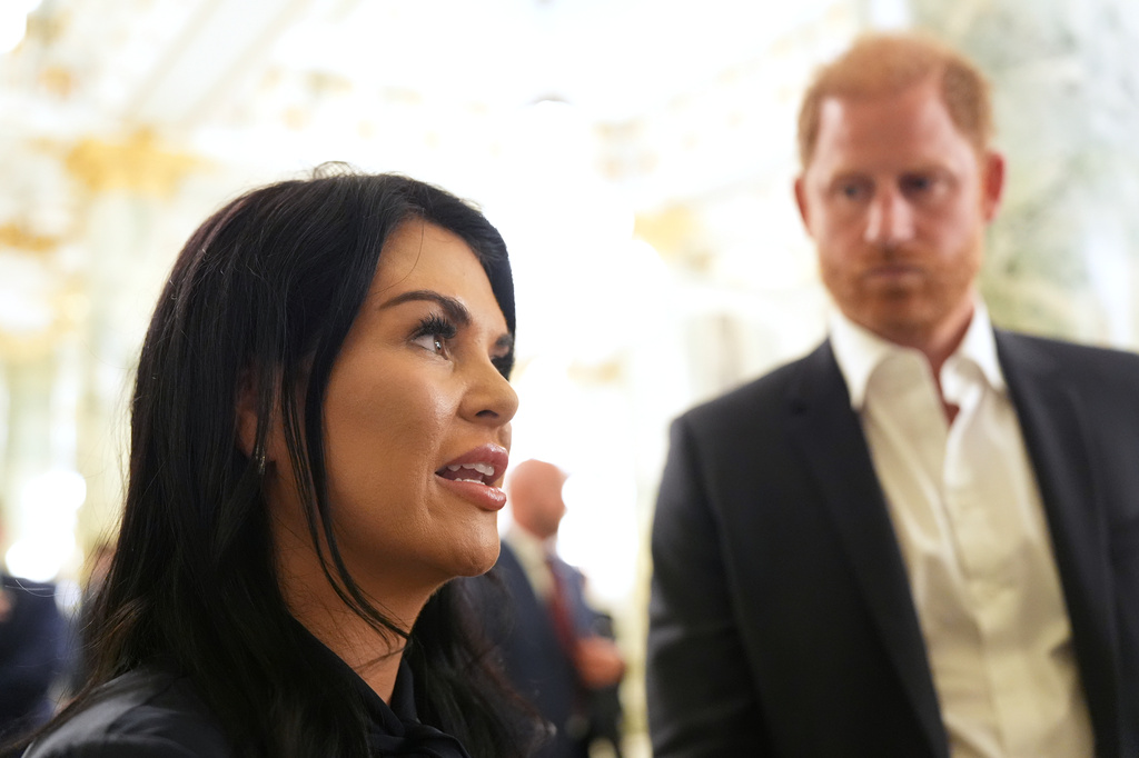 Britain's Prince Harry, the Duke of Sussex, listens as Sarah Verardo, CEO of The Independence Fund, speaks to The Associated Press after a roundtable about support for veterans, Wednesday, Aug. 19, 2026, in Washington. (AP Photo/Alex Brandon) CORRECTIONS: Corrects name to Verardo, instead of Verado