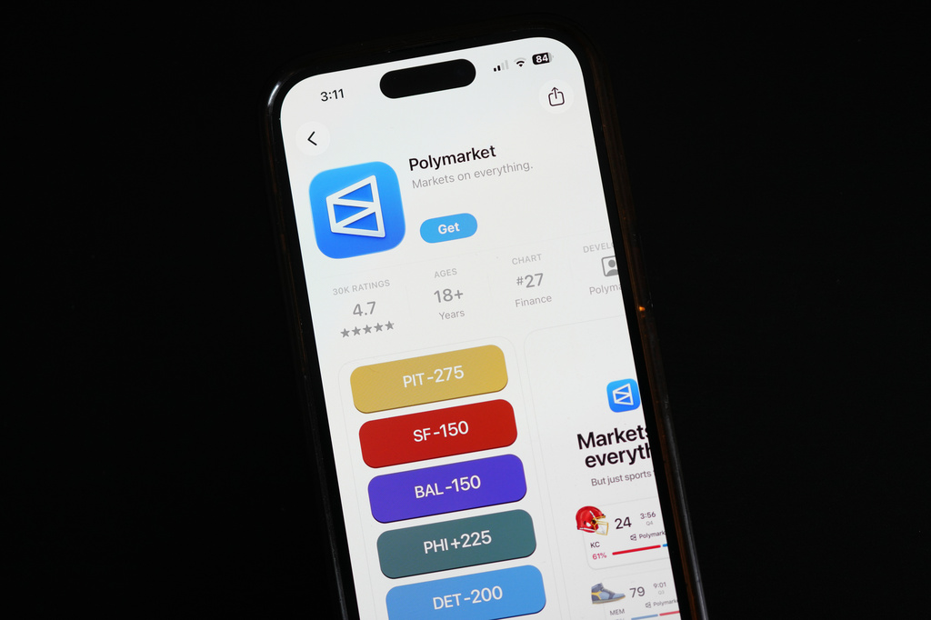 FILE - The prediction market app Polymarket is displayed on a mobile phone Thursday, April 16, 2026, in Chicago. (AP Photo/Erin Hooley, File)
