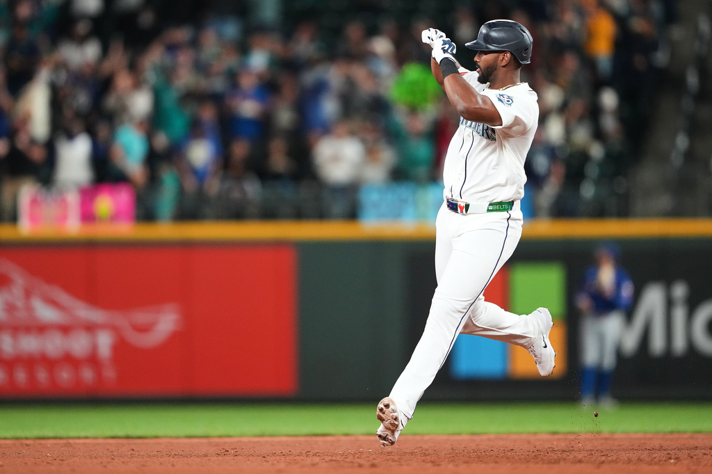 Seattle Mariners designated hitter Lazaro Montes jogs the bases after hitting a three-run home run against the Texas Rangers during the fourth inning of a baseball game, Tuesday, Sept. 8, 2026, in Seattle. (AP Photo/Lindsey Wasson)