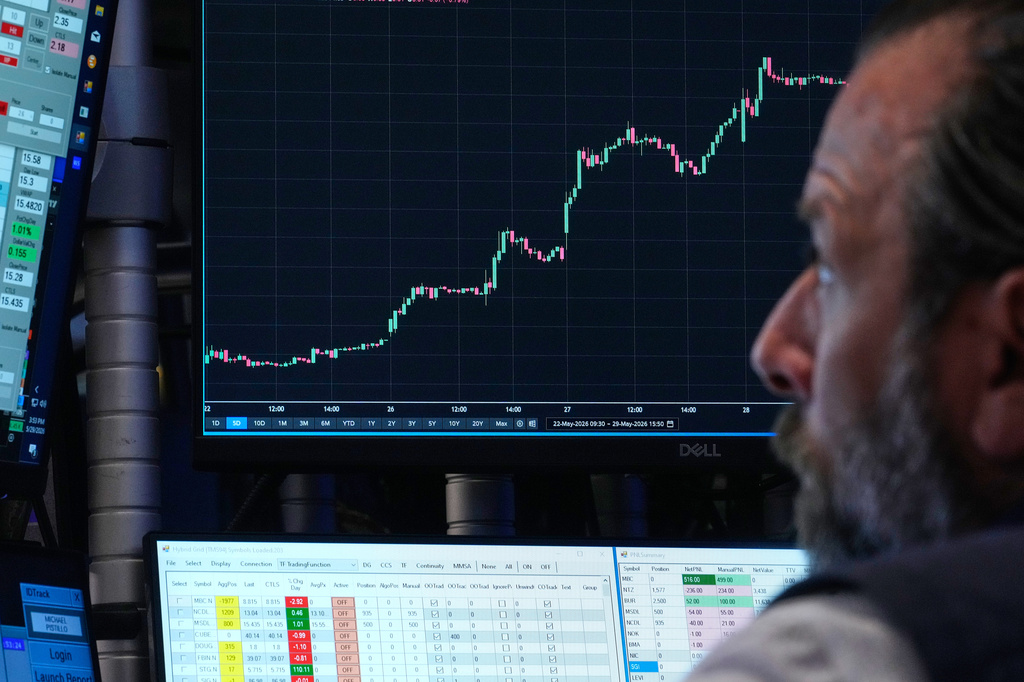 Specialist Michael Pistillo works at his post on the floor of the New York Stock Exchange, Friday, May 29, 2026. (AP Photo/Richard Drew)