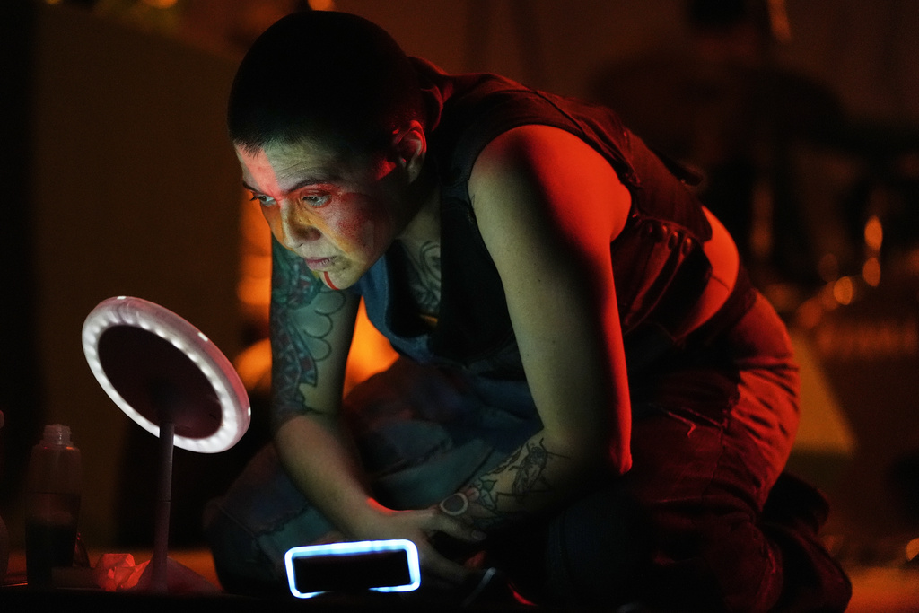 Mexican composer Maria Leonora performs her series she calls “Through All the Fire,” at the Sergio Magaña Theater in Mexico City, Friday, Nov. 28, 2025. (AP Photo/Claudia Rosel)