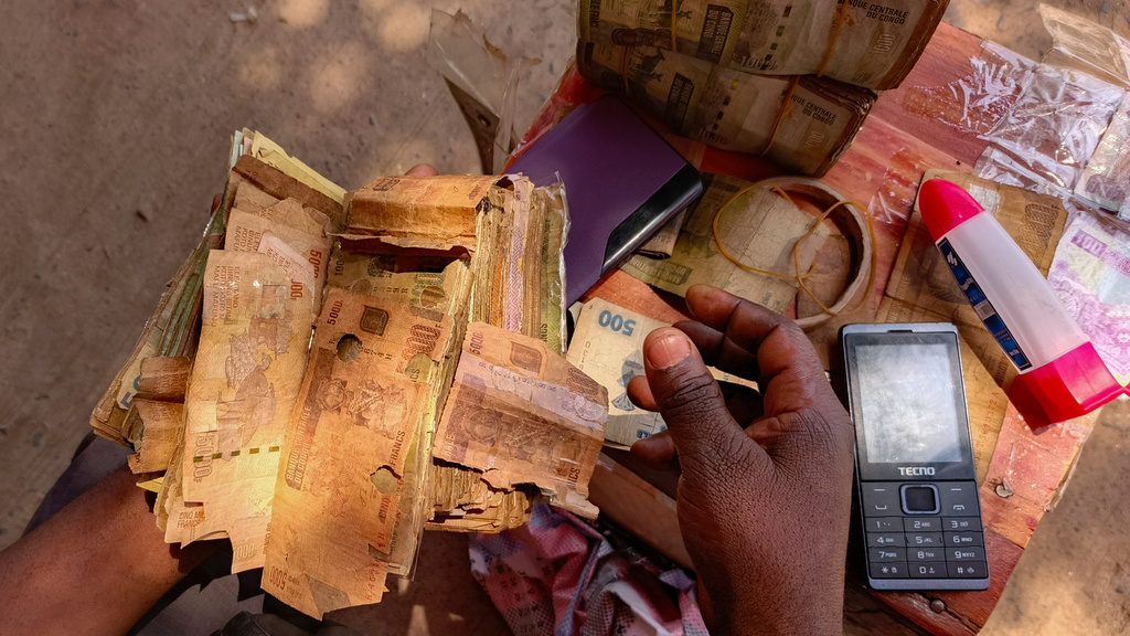 A close-up of perforated notes, which are rejected in Bukavu, Democratic Republic of the Congo, Friday, Aug 29, 2025. (AP Photo)