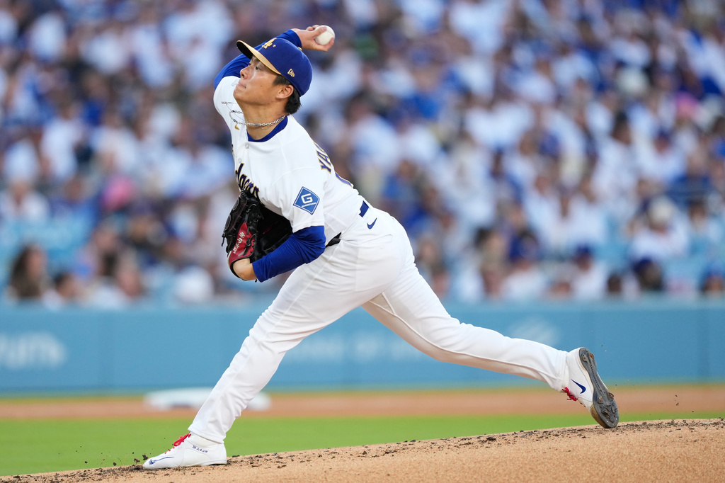 Los Angeles Dodgers pitcher Yoshinobu Yamamoto works against the Arizona Diamondbacks during the third inning of an opening-day baseball game Thursday, March 26, 2026, in Los Angeles. (AP Photo/Mark J. Terrill)
