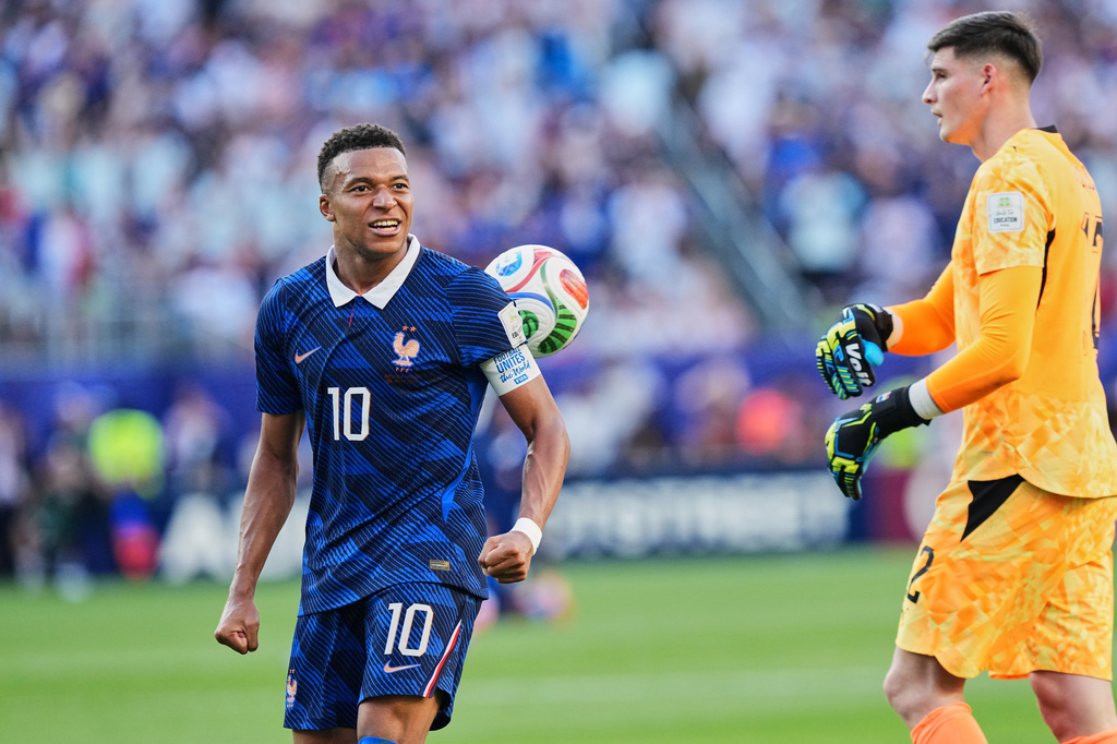 Paraguay goalkeeper Orlando Gill (12) throws the ball at France's Kylian Mbappe (10) at the end of the World Cup round of 16 soccer match between Paraguay and France in Philadelphia, Saturday, July 4, 2026. (AP Photo/Martin Meissner)