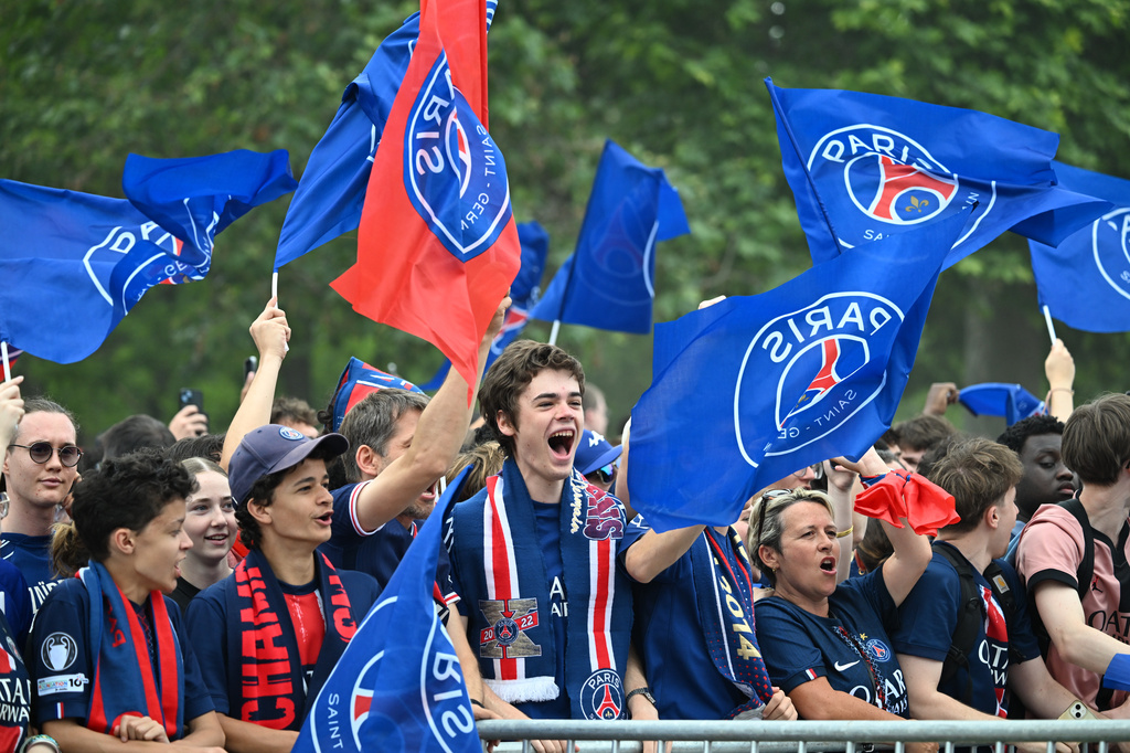PSG fans celebrate the day after winning the Champions League title, at the Eiffel Tower, in Paris, Sunday, May 31, 2026. (AP Photo/Emma Da Silva)