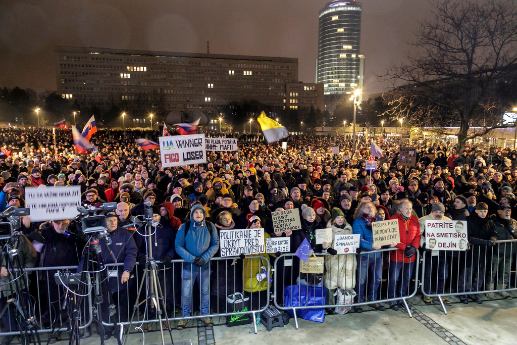 People attend a public protest against government's announced consolidation measures for next year organised by the opposition parties in Bratislava, Slovakia, on Tuesday Dec. 16, 2025. (Dano Veselsky/TASR via AP)