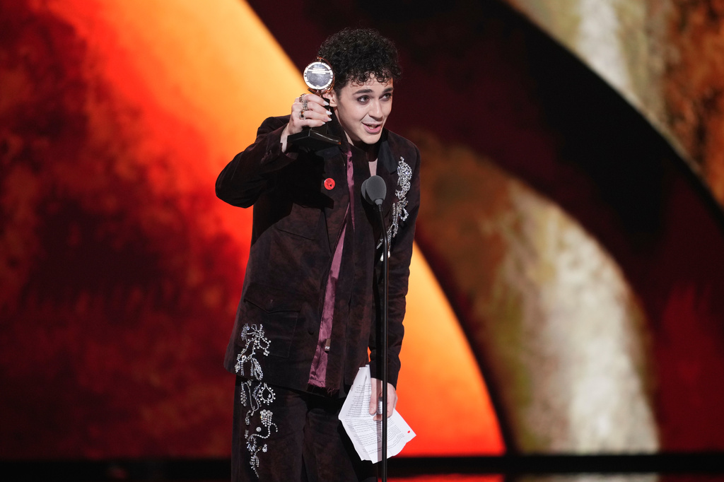 Ali Louis Bourzgui accepts the award for best performance by an actor in a featured role in a musical for "The Lost Boys" during the 79th Tony Awards on Sunday, June 7, 2026, at Radio City Music Hall in New York. (Photo by Charles Sykes/Invision/AP)