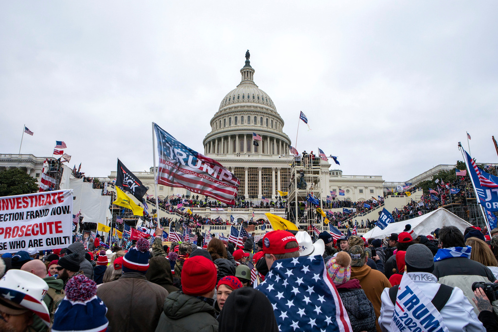 FILE - Rioters loyal to President Donald Trump rally at the U.S. Capitol in Washington, Jan. 6, 2021. (AP Photo/Jose Luis Magana, File)