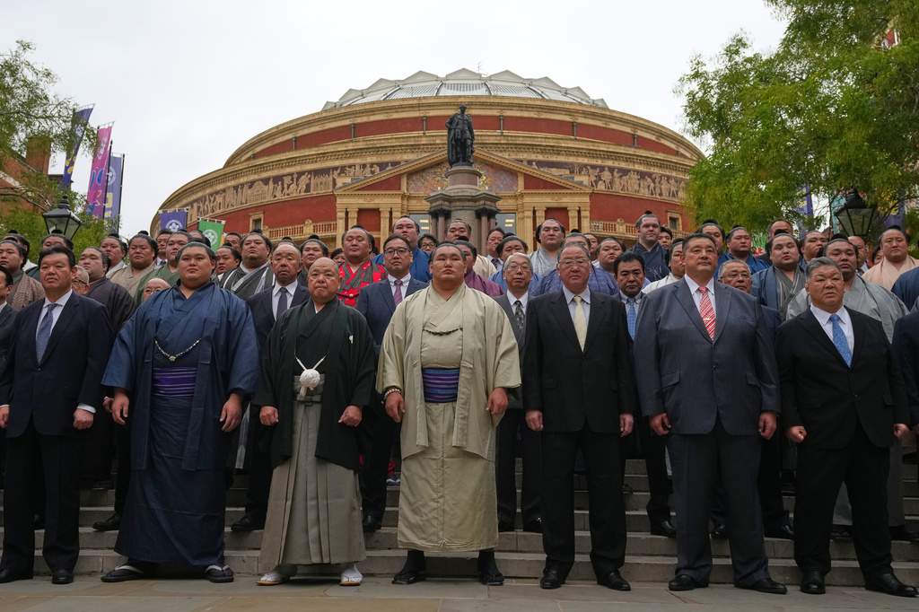 Sumo wrestlers, called rikishi, pose for a photocall ahead of The Grand Sumo Tournament at the Royal Albert Hall in London, Wednesday, Oct. 15, 2025.(AP Photo/Frank Augstein)