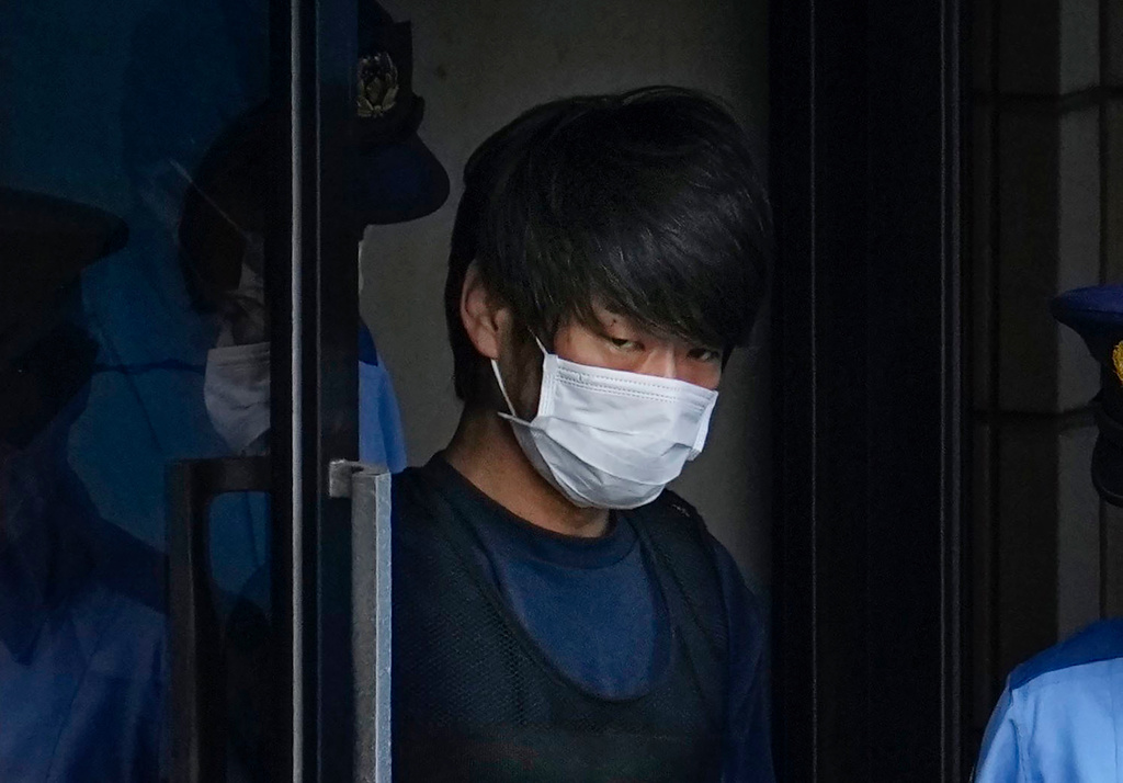 FILE - Tetsuya Yamagami, the alleged assassin of Japan's former Prime Minister Shinzo Abe, gets out of a police station in Nara, western Japan, on July 10, 2022, on his way to local prosecutors' office. (Nobuki Ito/Kyodo News via AP, File)