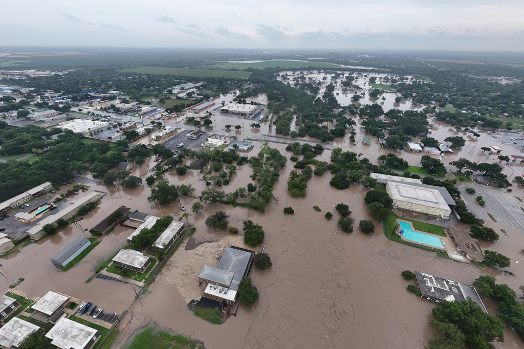 This aerial photo provided by David Fry shows flooding in Uvalde, Texas, on Thursday, July 16, 2026. (David Fry/Medina Real Estate Photography via AP)