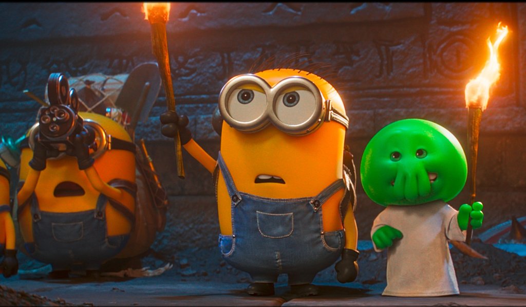This image released by Universal Pictures shows, from left, characters Ed, Henry and Goomi in a scene from Illumination’s "Minions & Monsters." (Universal Pictures via AP)