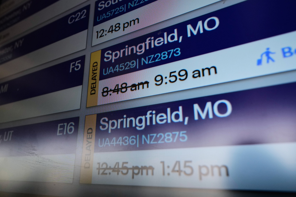 FILE - Flight times are displayed at O'Hare airport in Chicago, Tuesday, Dec. 23, 2025. (AP Photo/Nam Y. Huh, File)