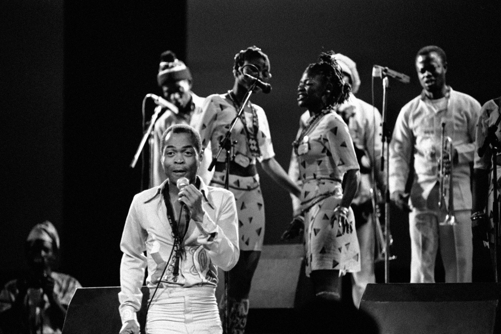 FILE- Nigerian musician and composer Fela Anikulapo Kuti performs with his band at the "Party of Humankind" of the French Communist Party at La Courneuve in Paris, France. Saturday, Sept 13, 1986. (AP Photo/Laurent Rebours, File)