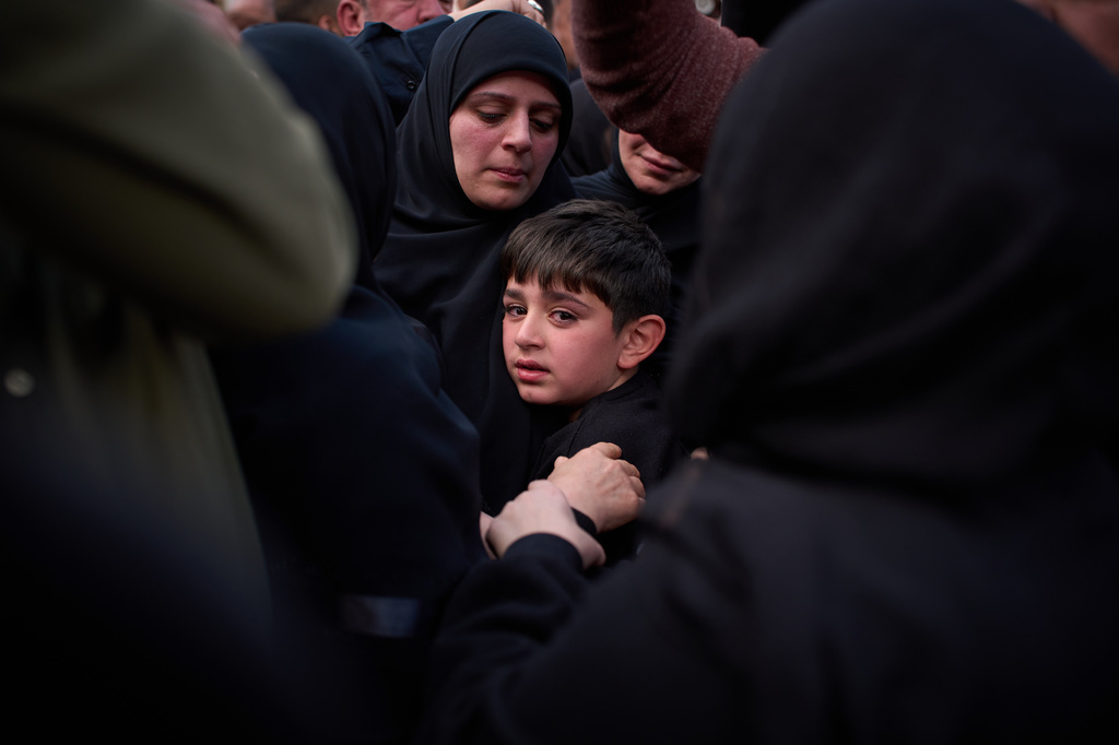 Mohammed, 8, cries next to the coffin of his father, Hussein Makkah, during the funeral of 13 state security officers killed the previous day in an Israeli strike in Lebanon’s coastal city of Sidon, Lebanon, Saturday, April 11, 2026. (AP Photo/Emilio Morenatti)