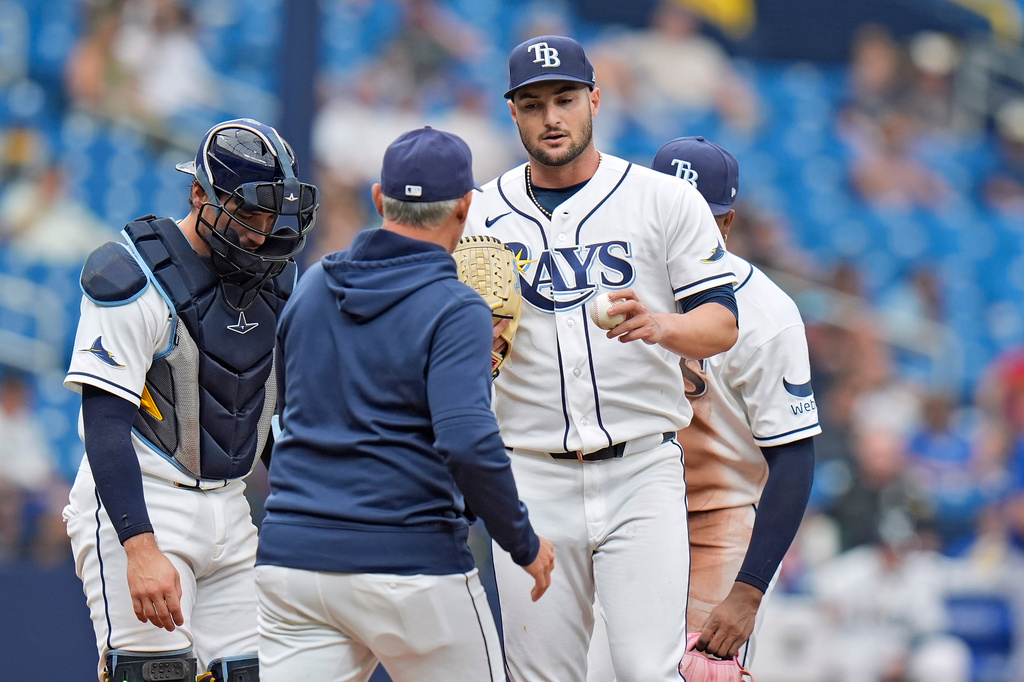 Tampa Bay Rays manager Kevin Cash, center, takes pitcher Shane McClanahan, right, out of the game against the Toronto Blue Jays during the sixth inning of a baseball game Wednesday, May 6, 2026, in St. Petersburg, Fla. (AP Photo/Chris O'Meara)