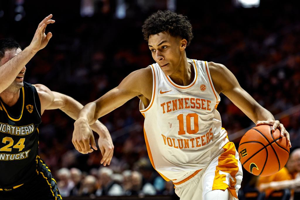 Tennessee forward Nate Ament (10) drives past Northern Kentucky forward Kael Robinson (24) during the first half of an NCAA college basketball game Saturday, Nov. 8, 2025, in Knoxville, Tenn. (AP Photo/Wade Payne)