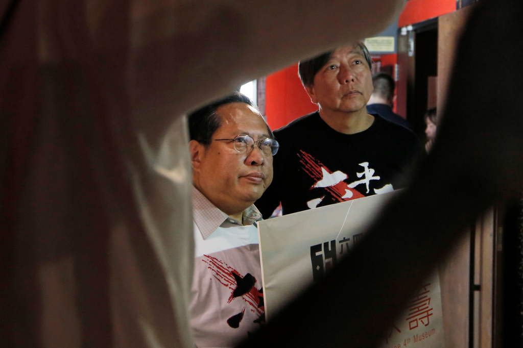 FILE - Pro-democracy lawmakers Lee Cheuk-yan, right, and Albert Ho, pose after a press conference in Hong Kong, on April 15, 2016. (AP Photo/Kin Cheung, File)