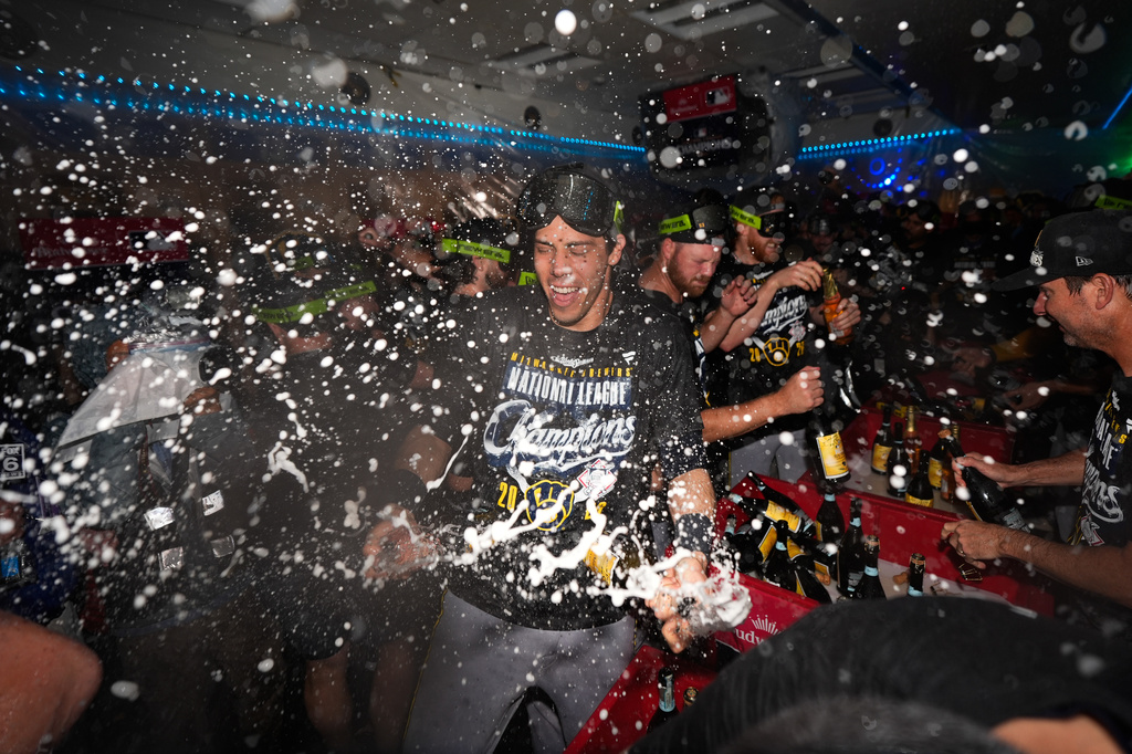 Milwaukee Brewers designated hitter Christian Yelich celebrates winning the NLCS Championship after Game 4 of baseball's National League Championship Series between the Milwaukee Brewers and the Los Angeles Dodgers, Thursday, Oct. 15, 2026, in Los Angeles. (AP Photo/Ashley Landis)