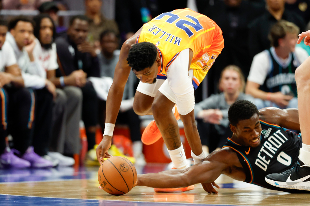 Charlotte Hornets forward Brandon Miller (24) battles Detroit Pistons center Jalen Duren (0) for the ball during the first half of an NBA basketball game in Charlotte, N.C., Friday, April 10, 2026. (AP Photo/Nell Redmond)