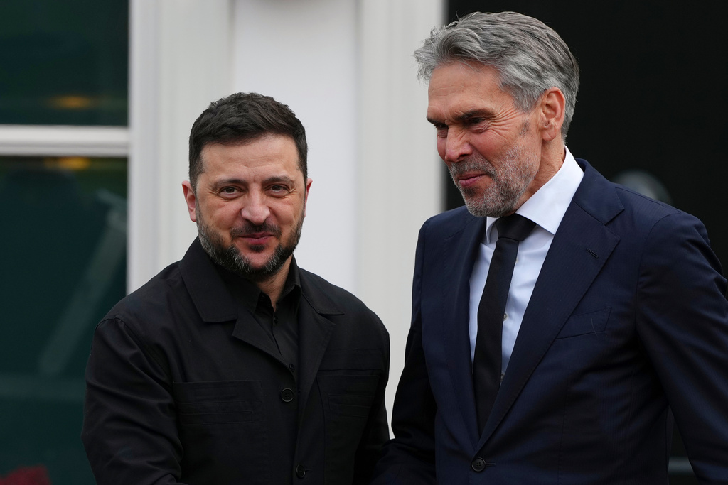 Dutch Prime Minister Dick Schoof, right, welcomes Ukraine's President Volodymyr Zelenskyy in The Hague, Netherlands, Tuesday, Dec. 16, 2025. (AP Photo/Peter Dejong)