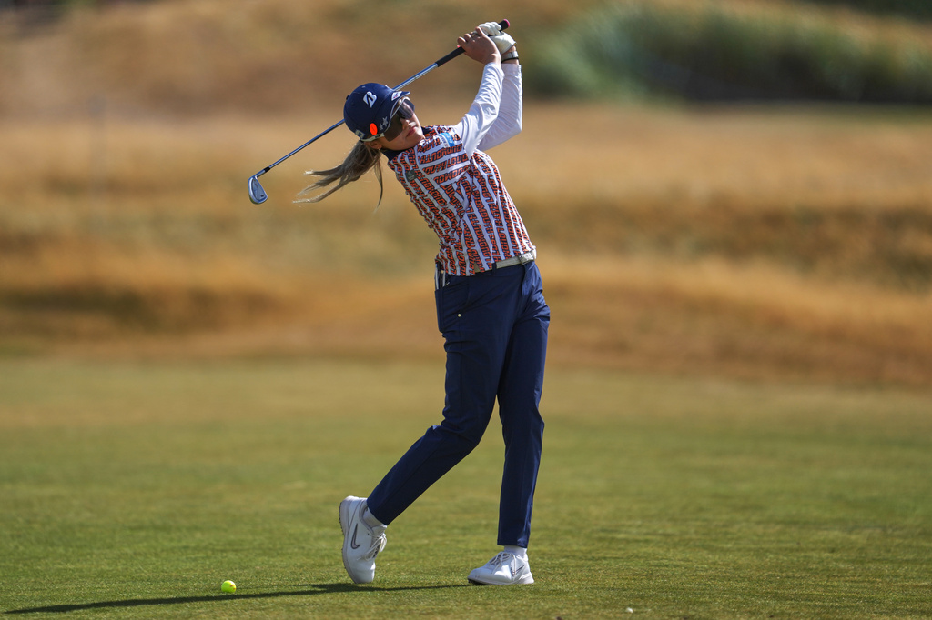 Shiho Kuwaki, of Japan, takes a practice swing on the 14th hole during the first round of the Women's British Open golf championship in Lytham St Annes, England, Thursday, July 30, 2026. (AP Photo/Jon Super)