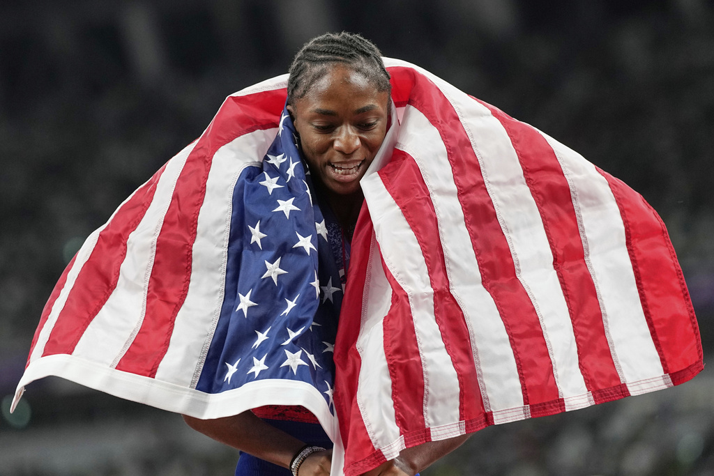 United States' Melissa Jefferson-Wooden celebrates after she won the gold medal in the women's 200 meters final at the World Athletics Championships in Tokyo, Friday, Sept. 19, 2025. (AP Photo/Petr David Josek)