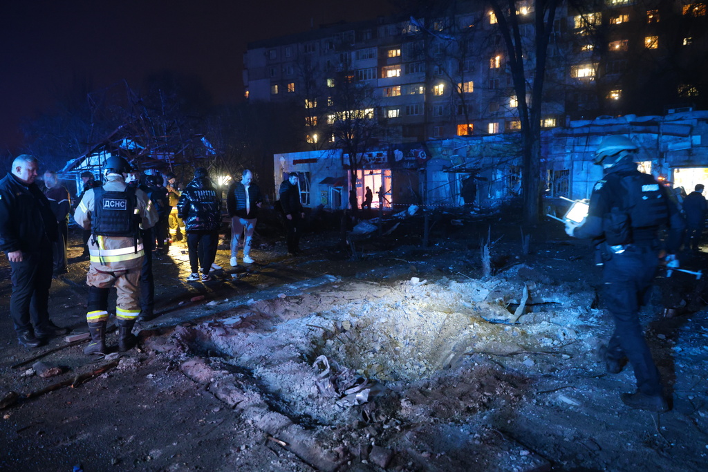 A crater is seen at a market destroyed by a Russian airstrike on Zaporizhzhia, Ukraine, Friday, Nov. 21, 2025. (AP Photo/Kateryna Klochko)