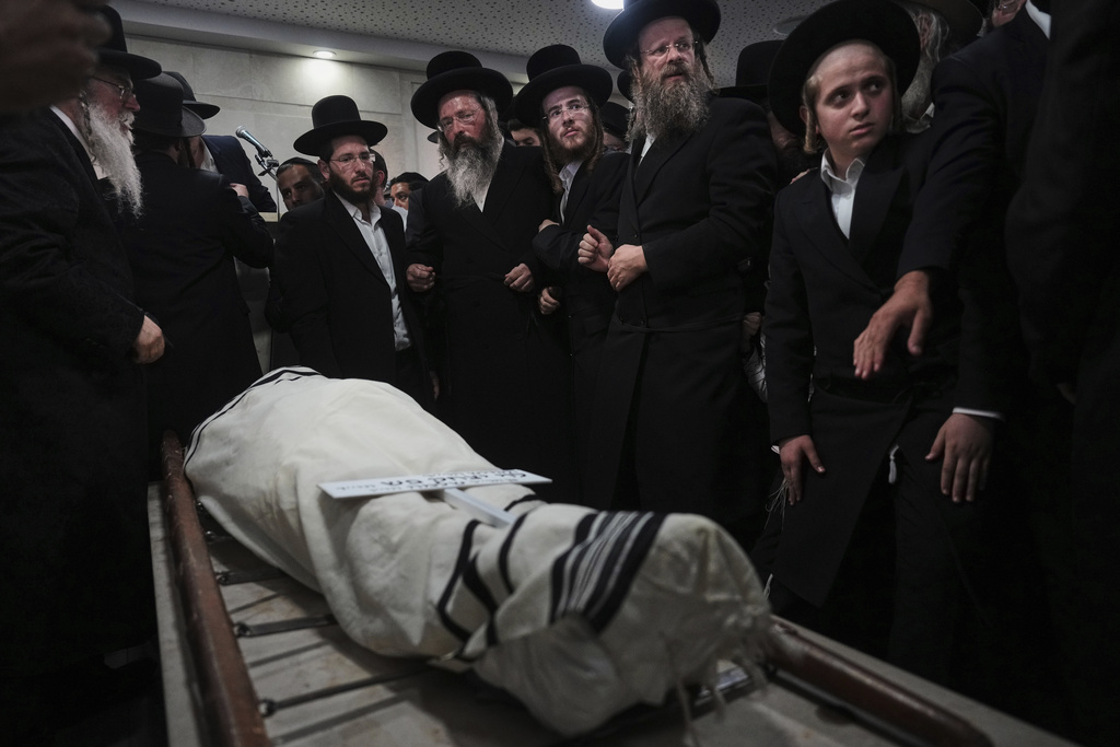 Mourners attend the funeral of Levi Yitzhak Pash, who was killed along with five other Israelis in a shooting attack by two Palestinian gunmen at a bus stop in Jerusalem Monday, Sept. 8, 2025. (AP Photo/Ariel Schalit)
