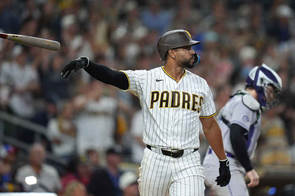 San Diego Padres shortstop Xander Bogaerts watches his sacrifice fly to defeat the Colorado Rockies 8-7 during the ninth inning of baseball game Tuesday, July 28, 2026, in San Diego. (AP Photo/Gregory Bull)