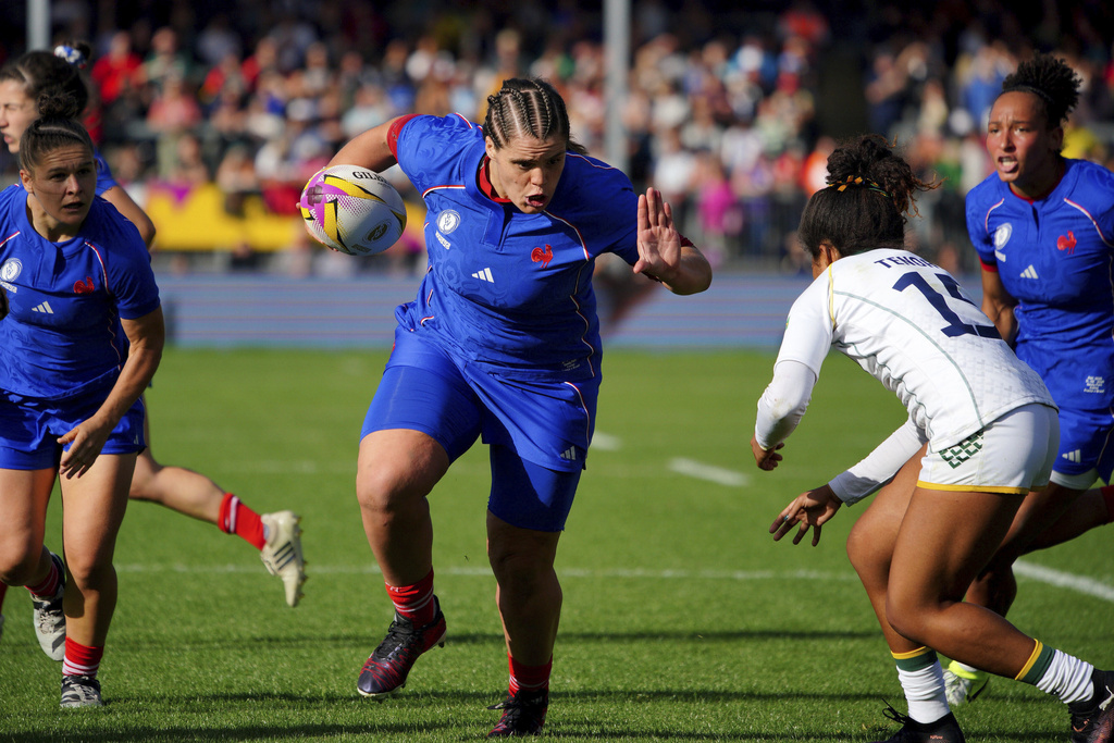 France's Annaelle Deshaye scores a try during the Women's Rugby World Cup 2025 Pool D match between France and Brazil a at Sandy Park, Exeter, England, Sunday Aug. 31, 2025. (Ben Birchall/PA via AP)