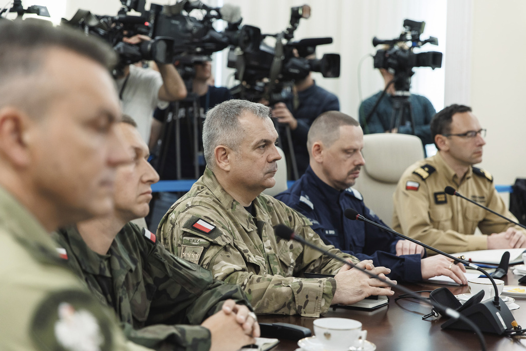 Gen. Wieslaw Kukula, center, chief of the General Staff of the Polish Armed Forces, sits during an extraordinary government meeting, in Warsaw, Poland, Wednesday, Sept. 10, 2025, following violations of Polish airspace by Russian drones. (Chancellery of the Prime Minister of Poland via AP)