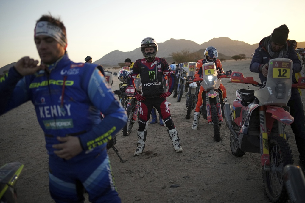 Riders prepare prior to the start of stage two, day two, of the Dakar Rally in Bisha, Saudi Arabia, Monday, Jan. 6, 2025. (AP Photo/Christophe Ena)