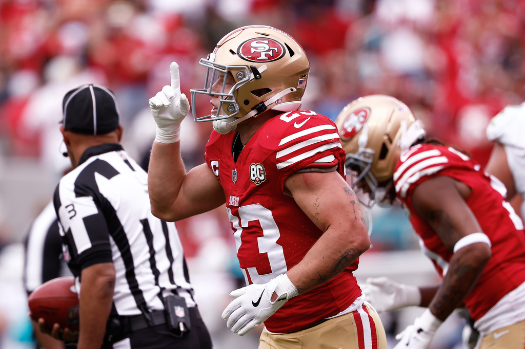 San Francisco 49ers running back Christian McCaffrey celebrates after scoring against the Miami Dolphins during the first half of an NFL football game in Santa Clara, Calif., Sunday, Sept. 20, 2026. (AP Photo/Kelley L. Cox)