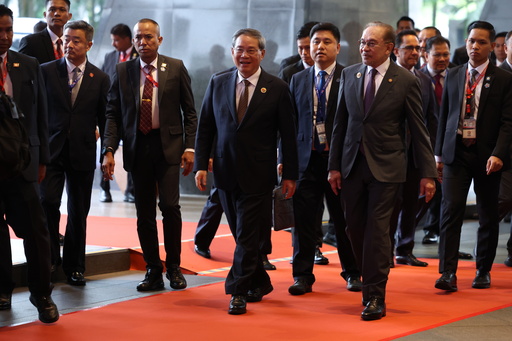 Malaysian Prime Minister Anwar Ibrahim, front right, and Chinese Premier Li Qiang, front left, they arrive ahead of the signing ceremony for the ASEAN–China Free Trade Area 3.0 Upgrade and the ASEAN–China summit, held as part of the ASEAN summit in Kuala Lumpur, Malaysia Tuesday, Oct. 28, 2025. (Chalinee Thirasupa/Pool Photo via AP) Malaysian Prime Minister Anwar Ibrahim, front right, and Chinese Premier Li Qiang, front left, they arrive ahead of the signing ceremony for the ASEAN–China Free Trade Area 3.0 Upgrade and the ASEAN–China summit, held as part of the ASEAN summit in Kuala Lumpur, Malaysia Tuesday, Oct. 28, 2025. (Chalinee Thirasupa/Pool Photo via AP)