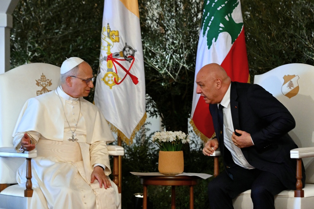 Pope Leo XIV talks with Lebanese President Joseph Aoun during a farewell ceremony at the Beirut International Airport in Beirut, Lebanon, Tuesday, Dec. 2, 12025. (Andreas Solaro/Pool Photo via AP)