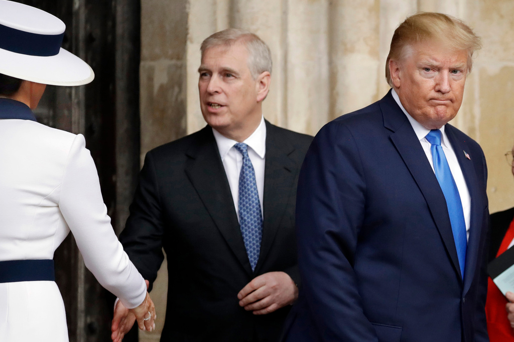 FILE - President Donald Trump, right, and first lady Melania Trump, left, accompanied by Britain's Prince Andrew, leave after a tour of Westminster Abbey in London, June 3, 2019. (AP Photo/Matt Dunham, File)