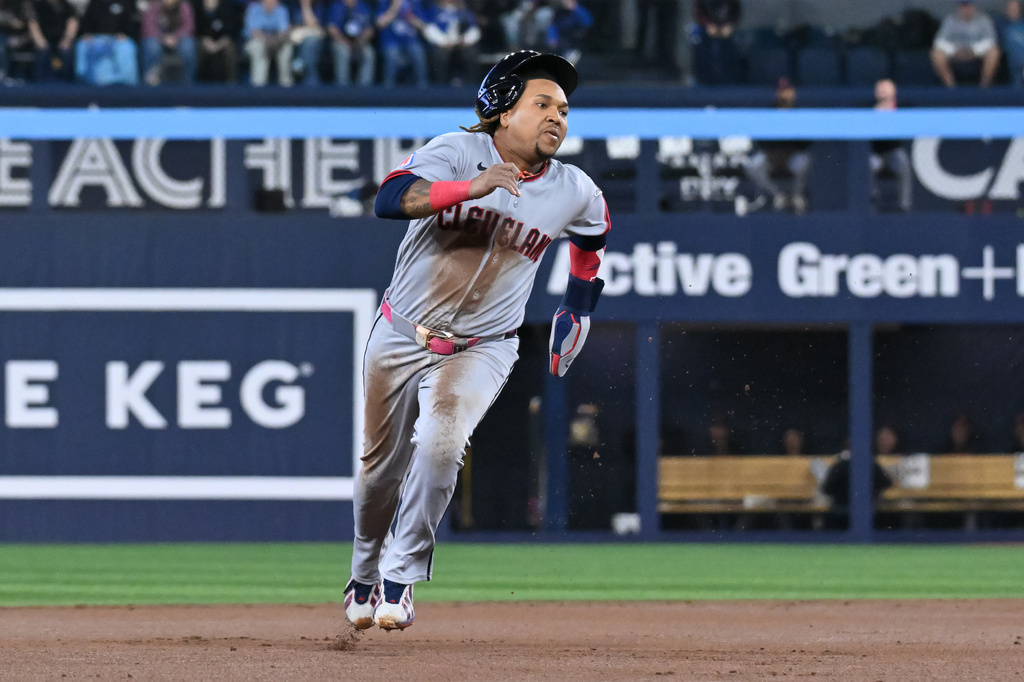 Cleveland Guardians' Jose Ramirez runs to third base during first-inning baseball game action against the Toronto Blue Jays in Toronto, Friday, April 24, 2026. (Jon Blacker/The Canadian Press via AP)