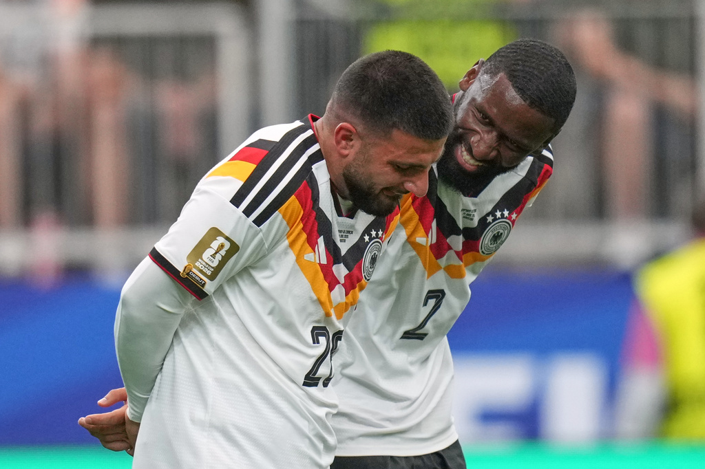 Germany's Deniz Undav, left, and Antonio Ruediger reacts after scoring the sixth goal during the World Cup Group E soccer match between Germany and Curacao in Houston, Sunday, June 14, 2026. (AP Photo/Eric Gay)